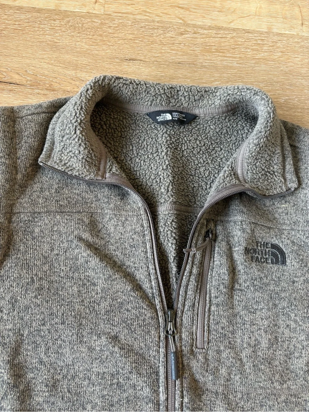 The North Face Men’s Brown Fleece Vest with zippered pockets